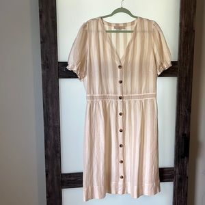 Cute linen neutral dress with wood grain buttons and verticals strips
